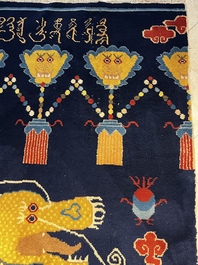 A Sino-Tibetan inscribed woollen 'Dragon' pillar carpet, 19th C.