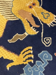 A Sino-Tibetan inscribed woollen 'Dragon' pillar carpet, 19th C.