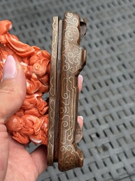 Three Chinese red coral carvings on wooden stands, 19/20th C.