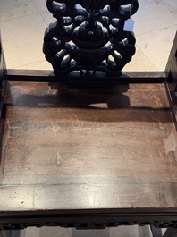 A Chinese carved hongmu armchair, 19th C.