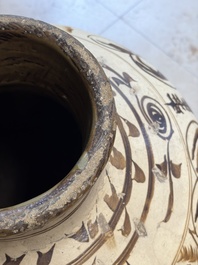 A large Chinese Cizhou ware slip-glazed wine jar, Ming