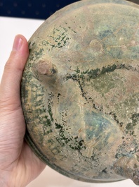 A Chinese green-glazed pottery ritual tripod food vessel with handles, 'Ding 鼎', Han