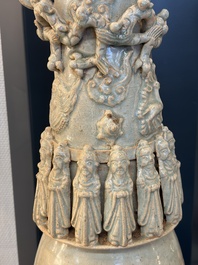A large Chinese qingbai covered urn applied with immortals and a dragon, Northern Song