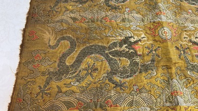 Two Chinese yellow-ground kesi silk 'Dragon' panels, late Ming