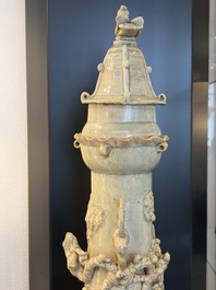 A large Chinese qingbai covered urn applied with immortals and a dragon, Northern Song