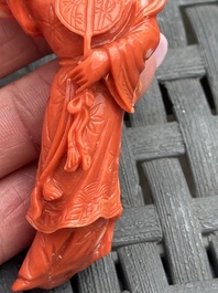 Three Chinese red coral carvings on wooden stands, 19/20th C.