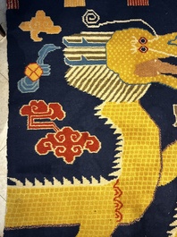 A Sino-Tibetan inscribed woollen 'Dragon' pillar carpet, 19th C.