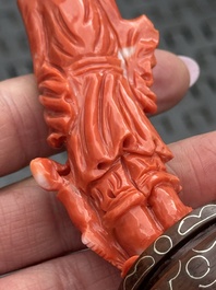 Three Chinese red coral carvings on wooden stands, 19/20th C.
