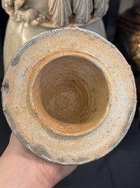 A large Chinese qingbai covered urn applied with immortals and a dragon, Northern Song