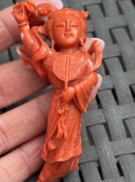 Three Chinese red coral carvings on wooden stands, 19/20th C.