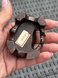 Three Chinese red coral carvings on wooden stands, 19/20th C.
