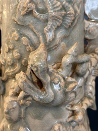 A large Chinese qingbai covered urn applied with immortals and a dragon, Northern Song