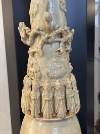 A large Chinese qingbai covered urn applied with immortals and a dragon, Northern Song