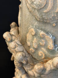 A large Chinese qingbai covered urn applied with immortals and a dragon, Northern Song