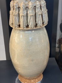 A large Chinese qingbai covered urn applied with immortals and a dragon, Northern Song