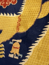 A Sino-Tibetan inscribed woollen 'Dragon' pillar carpet, 19th C.