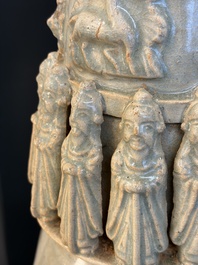 A large Chinese qingbai covered urn applied with immortals and a dragon, Northern Song