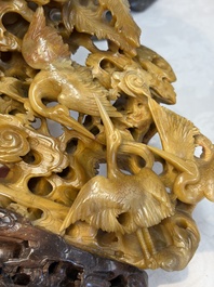A fine Chinese carved soapstone 'Dragons among Clouds' group and a 'Phoenixes and Cranes' group, 20th C.