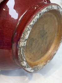 A Chinese flamb&eacute;-glazed vase and a jar with wooden cover, 19th C.