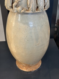 A large Chinese qingbai covered urn applied with immortals and a dragon, Northern Song