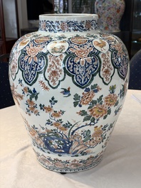 A large Dutch Delft cashmere palette vase with a phoenix and birds among flowers, ca. 1700