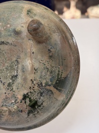 A Chinese green-glazed pottery ritual tripod food vessel with handles, 'Ding 鼎', Han