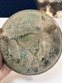 A Chinese green-glazed pottery ritual tripod food vessel with handles, 'Ding 鼎', Han