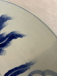 A massive Japanese blue and white 'Dragon among Sea Waves' dish, probably Arita, Meiji, 19th C.