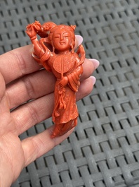Three Chinese red coral carvings on wooden stands, 19/20th C.