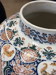 A large Dutch Delft cashmere palette vase with a phoenix and birds among flowers, ca. 1700