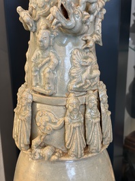A large Chinese qingbai covered urn applied with immortals and a dragon, Northern Song