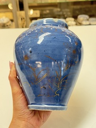A rare pair of Japanese gilt-decorated blue-ground vases, Edo, late 17th C.