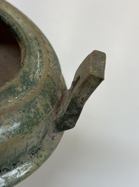 A Chinese green-glazed pottery ritual tripod food vessel with handles, 'Ding 鼎', Han