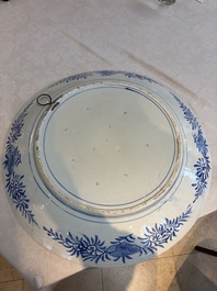 A massive Japanese blue and white 'Dragon among Sea Waves' dish, probably Arita, Meiji, 19th C.