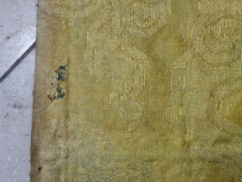 A Chinese cream-ground embroidered silk panel with bats, floral scrolls, waves and rockwork, 19th C.