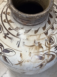 A large Chinese Cizhou ware slip-glazed wine jar, Ming