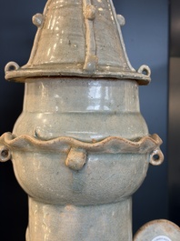 A large Chinese qingbai covered urn applied with immortals and a dragon, Northern Song