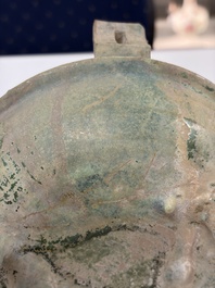 A Chinese green-glazed pottery ritual tripod food vessel with handles, 'Ding 鼎', Han