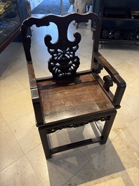 A Chinese carved hongmu armchair, 19th C.