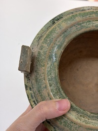 A Chinese green-glazed pottery ritual tripod food vessel with handles, 'Ding 鼎', Han