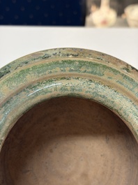 A Chinese green-glazed pottery ritual tripod food vessel with handles, 'Ding 鼎', Han