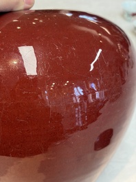 A Chinese flamb&eacute;-glazed vase and a jar with wooden cover, 19th C.