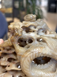 A fine Chinese carved soapstone 'Dragons among Clouds' group and a 'Phoenixes and Cranes' group, 20th C.