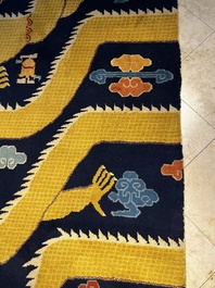 A Sino-Tibetan inscribed woollen 'Dragon' pillar carpet, 19th C.