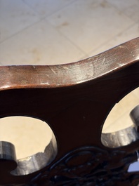 A Chinese carved hongmu armchair, 19th C.