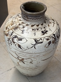 A large Chinese Cizhou ware slip-glazed wine jar, Ming