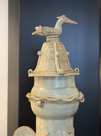 A large Chinese qingbai covered urn applied with immortals and a dragon, Northern Song