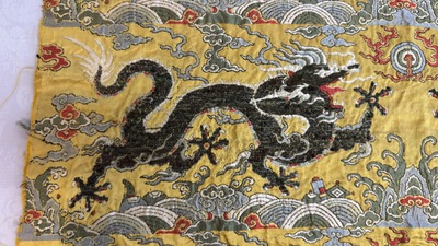 Two Chinese yellow-ground kesi silk 'Dragon' panels, late Ming