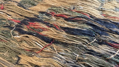 Two Chinese yellow-ground kesi silk 'Dragon' panels, late Ming