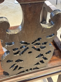 A Chinese carved hongmu armchair, 19th C.